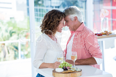 Smiling couple standing face to face