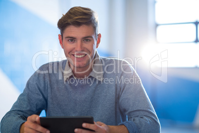 Young businessman using digital tablet