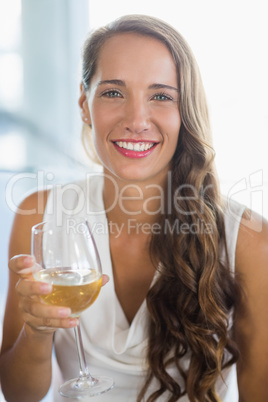 Portrait of smiling woman holding a beer glass