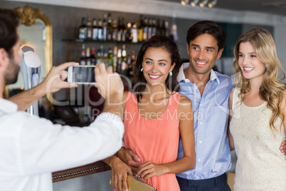 Man taking photo of his friends