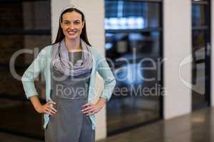 Smiling businesswoman standing in office