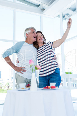 Happy couple taking selfie