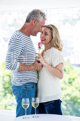 Romantic mature couple with pink rose