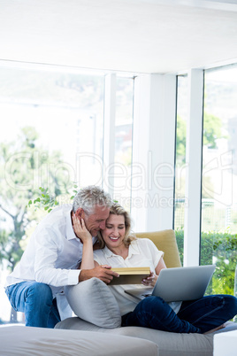 Romantic happy mature couple with gift box