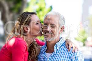 Romantic mature woman kissing man