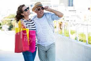 Joyful couple standing on walkway