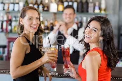 Beautiful women holding cocktail glasses