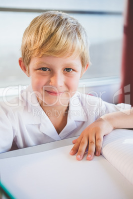 Schoolkid doing homework in classroom