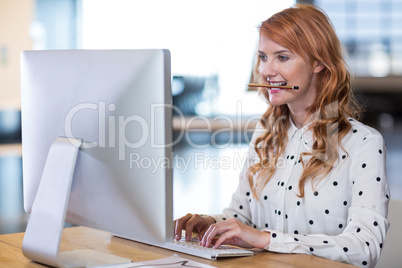 Young businesswoman working on computer