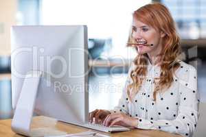 Young businesswoman working on computer
