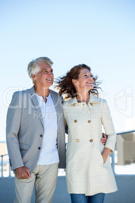 Happy couple standing on walkway