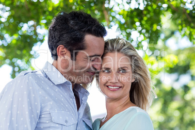 Romantic couple against trees