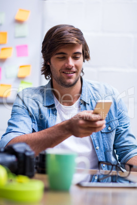 Man using mobile phone in office