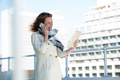 Smiling woman using digital tablet Smiling woman using digital tablet