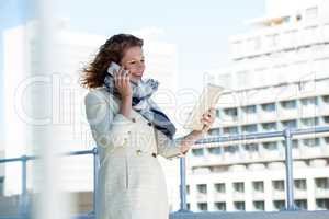 Smiling woman using digital tablet