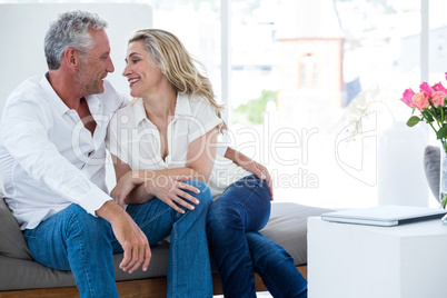 Romantic mature couple sitting face to face