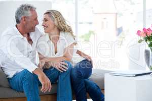 Romantic mature couple sitting face to face