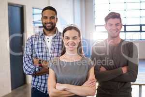 Happy colleagues standing in office