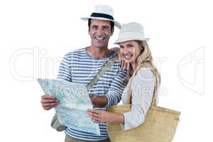 Couple holding map against white background