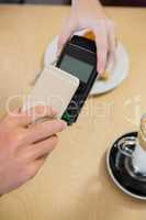Cstomer making payment through smartphone
