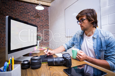 Focused man using computer in office