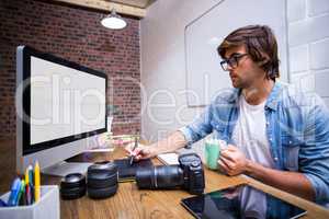 Focused man using computer in office