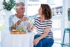 Couple toasting champagne at restaurant