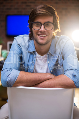 Portrait of smiling man sitting on chair