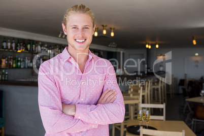 Portrait of restaurant manager with arms crossed