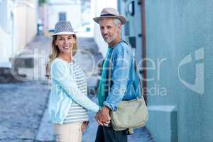 Portrait of smiling mature couple on street