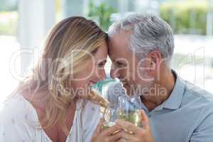 Romantic mature couple holding wineglass