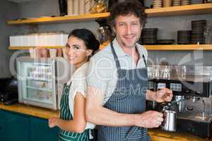 Waiter and waitress in cafeteria