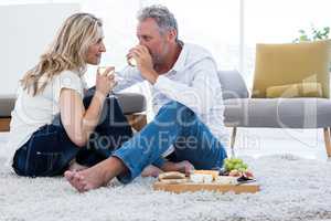 Romantic couple drinking white wine at home
