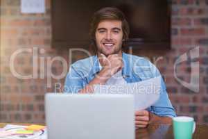 Businessman holding document in office