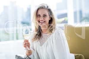 Woman holding wineglass at home
