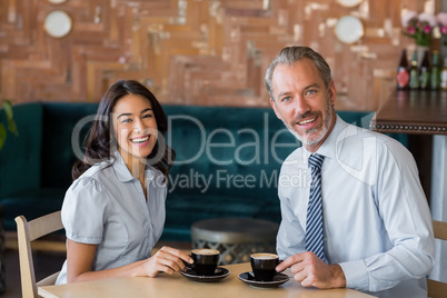 Man and woman meeting over coffee in restaurant