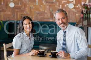 Man and woman meeting over coffee in restaurant