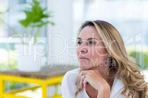 Thoughtful mature woman in restaurant