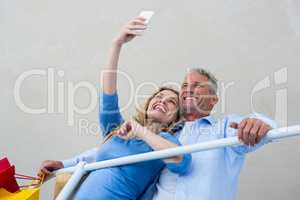 Couple taking selfie at home