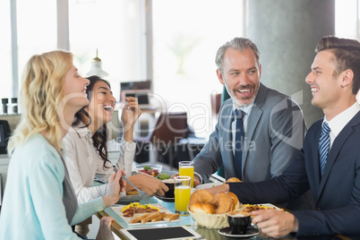 Business people having meal in restaurant