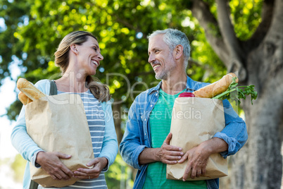 Happy couple holding shopping bags