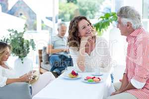 Couple smiling while talking in restaurant