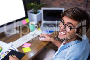 Portrait of smiling man in creative office