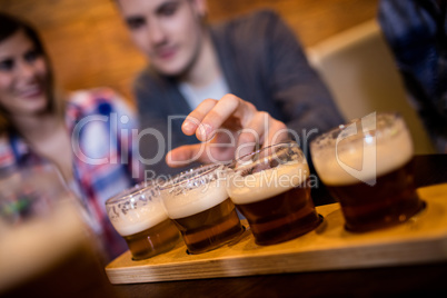 Man taking beer glass at restaurant