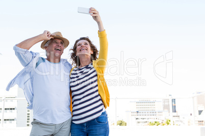 Happy couple taking selfie