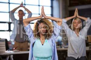 Business people practicing yoga
