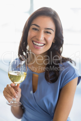 Portrait of smiling woman holding a beer glass