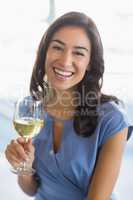 Portrait of smiling woman holding a beer glass