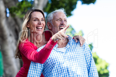 Romantic couple standing against tree