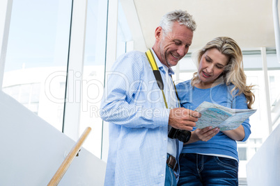 Mature couple reading map